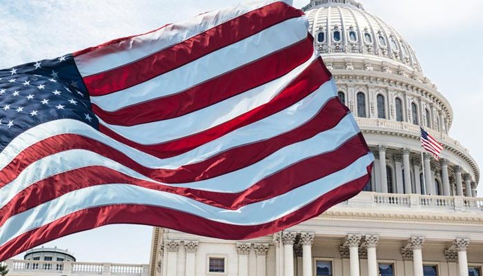 United States flag in front of capitol building